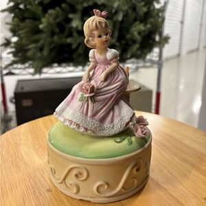 Charming Pink Figurine with Floral Accents